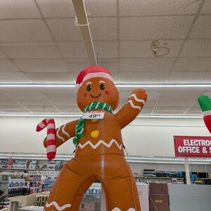 One left:Inflatable Gingerbread Man with Santa Hat